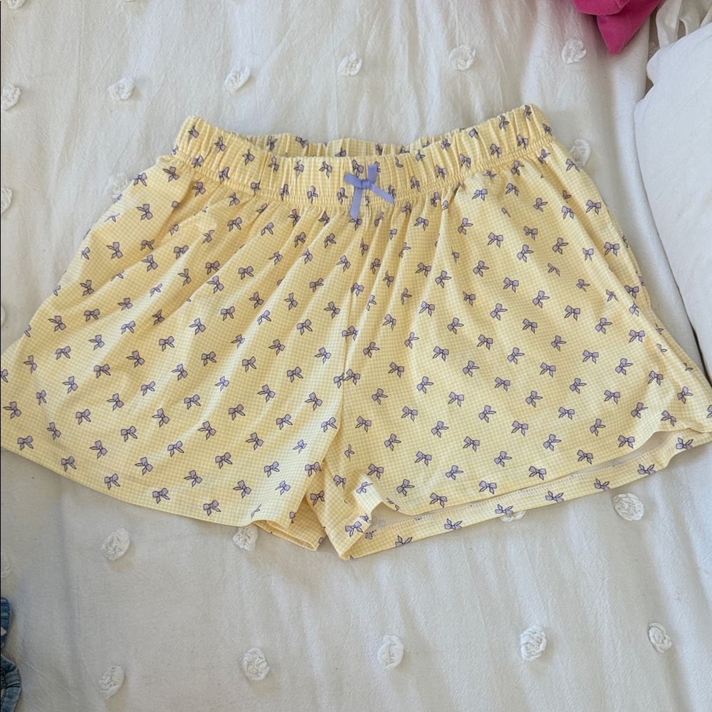 Yellow Shorts with Purple Bow Design